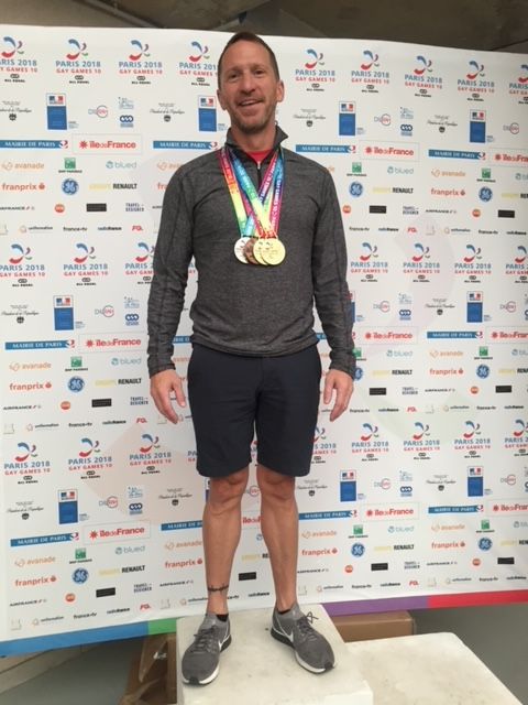 Matthew Kinney with his medals at the 2018 Gay Games in Paris.